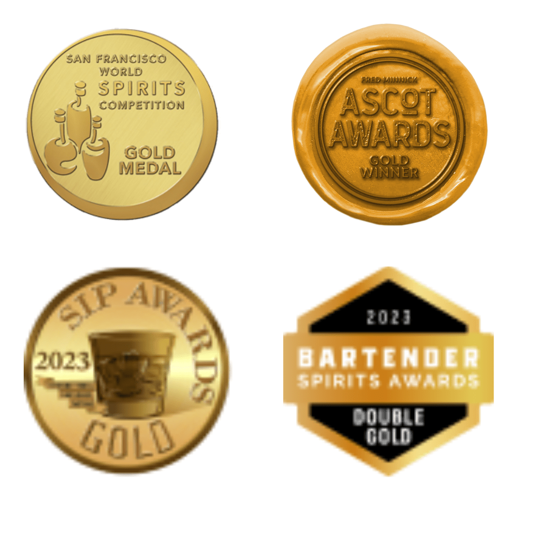 A photo of a group of three gold medals on a white background. The medals are from left to right: San Francisco World Spirits Competition, Ascot Awards, and Bartenders Spirits Awards. All three medals say