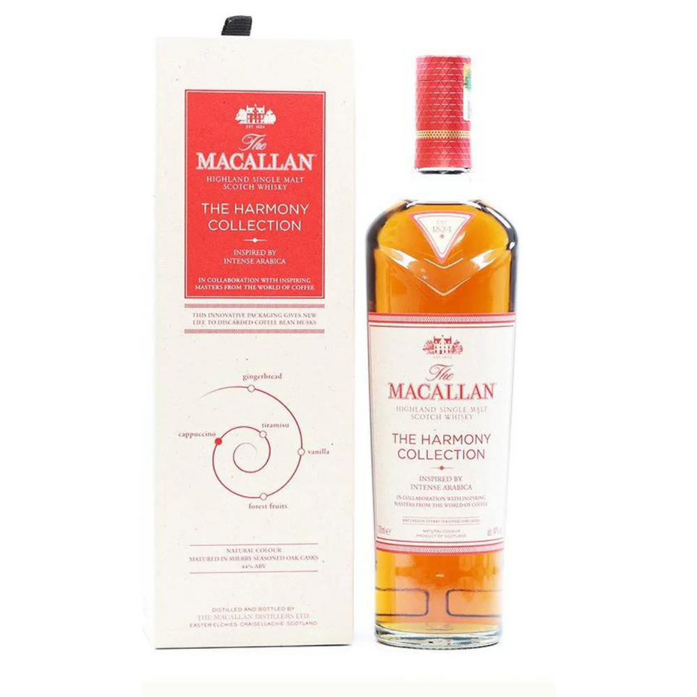 A photo of a bottle of The Macallan Harmony Collection whisky in a presentation box. The bottle is short and rounded with a black and gold label. The label text includes "The Macallan" and "The Harmony Collection." The box is light brown cardboard with gold lettering that says "The Macallan" and "The Harmony Collection."