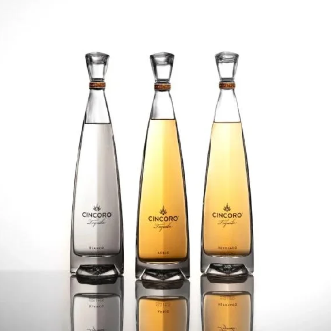 Three Cincoro tequila bottles in different flavours on a white background